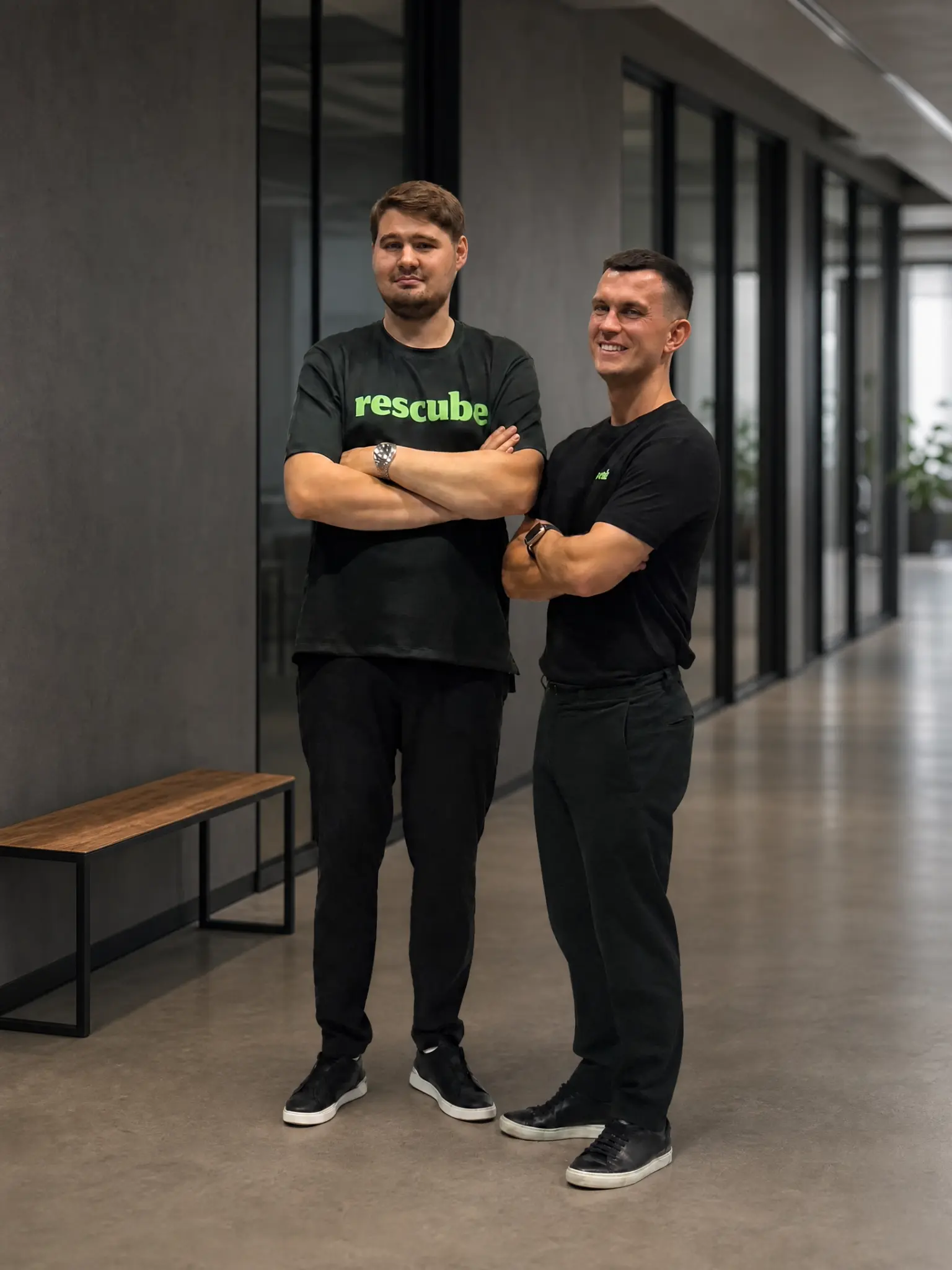Two members of the Rescube team wearing black Rescube shirts